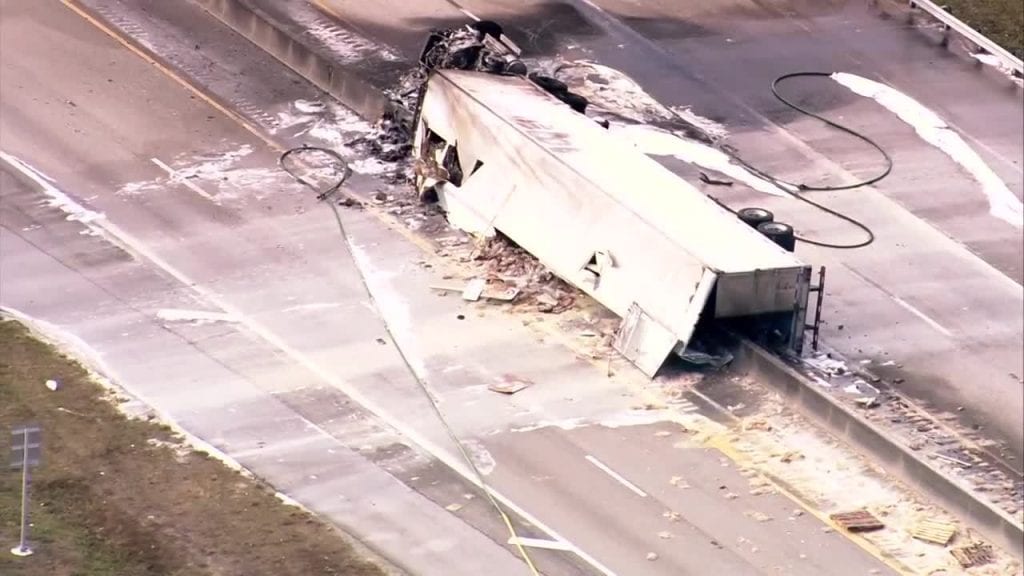 Semi-truck overturns, catches fire on Florida's Turnpike