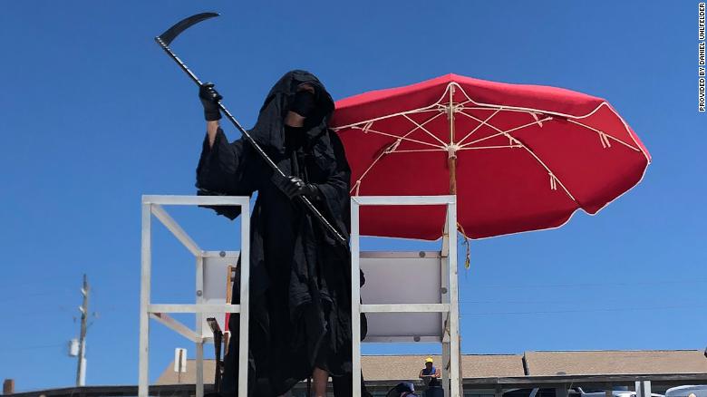 A lawyer dressed as the Grim Reaper is haunting Florida beaches to protest their reopening