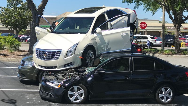 Whoops: Florida man backs Cadillac into, and on top of two parked cars: report