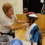 Child Being Fitted With Helmet