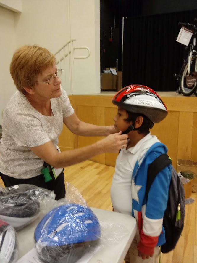 Child Being Fitted With Helmet