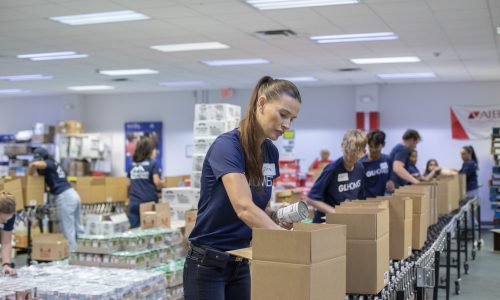 GL Homes volunteers participate in a Pack the Pantry event at Harry Chapin Food Bank on June 4